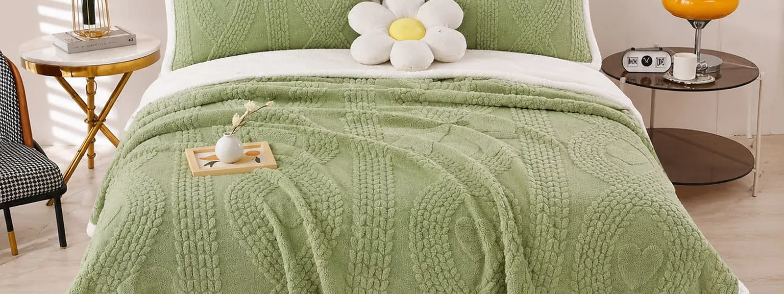 Sage cable-knit sherpa bedspread in a bright bedroom